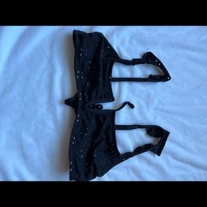 Black target bikini top, floral cut outs, ruffled shoulders, size M, tie back